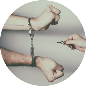 Image of hands in cuffs.