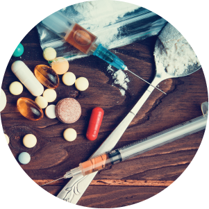 Drug concept. Top view of table with pills, syringes, spoons with powder.