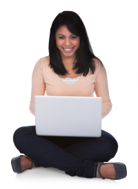 Photo of young woman sitting cross-legged using laptop.